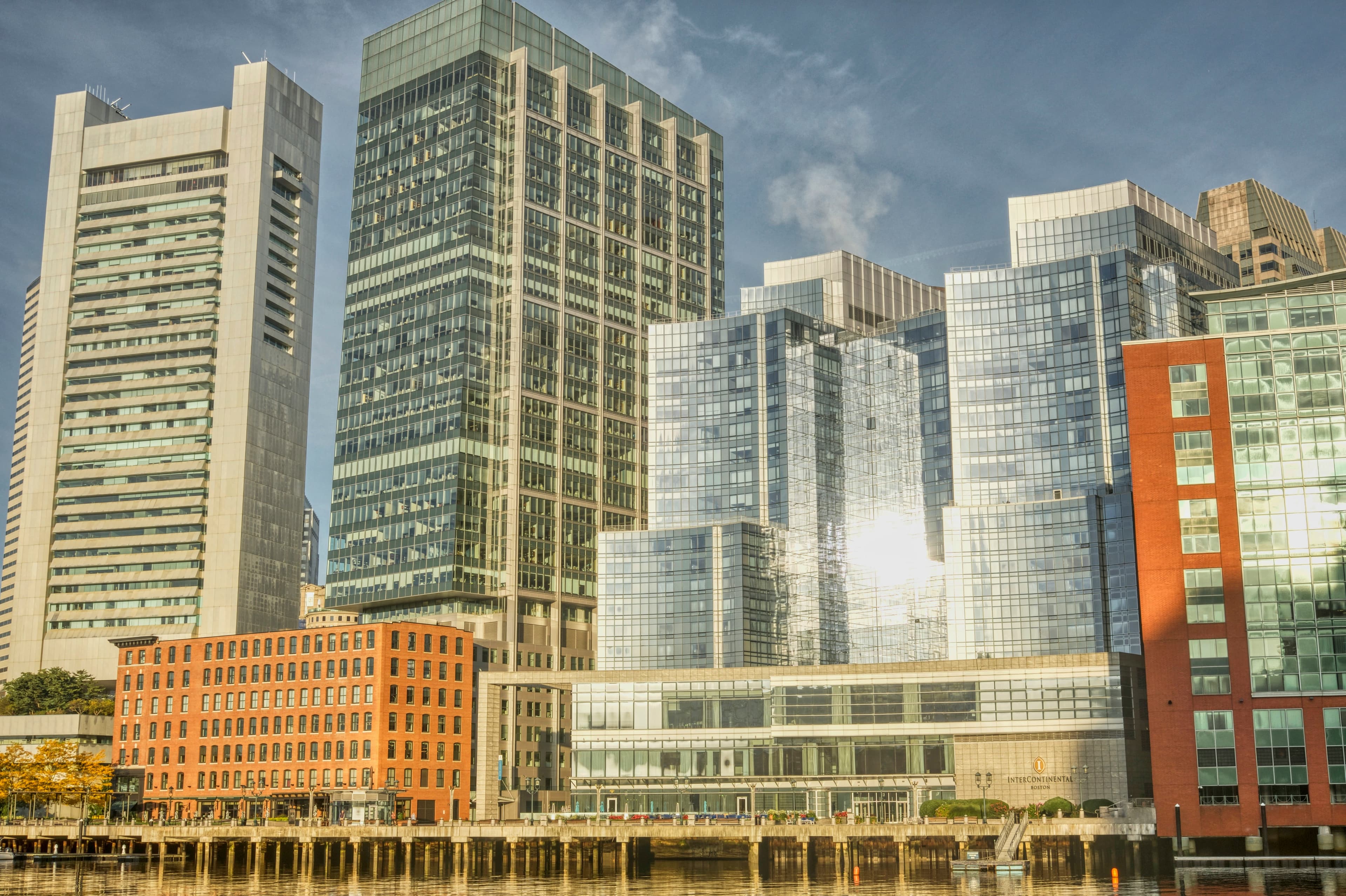 City skyline with sun shining off buildings