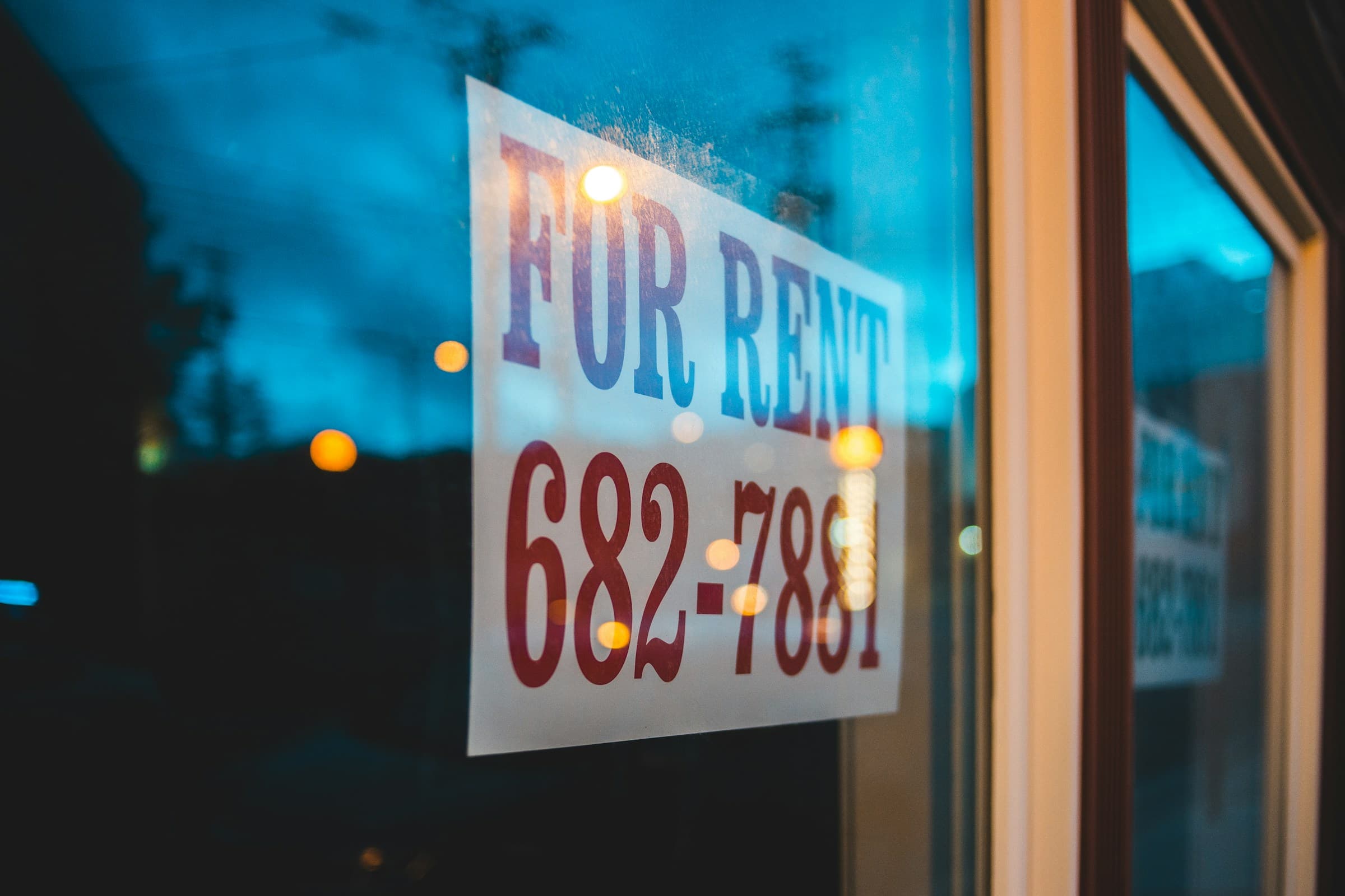 For rent sign hanging in window